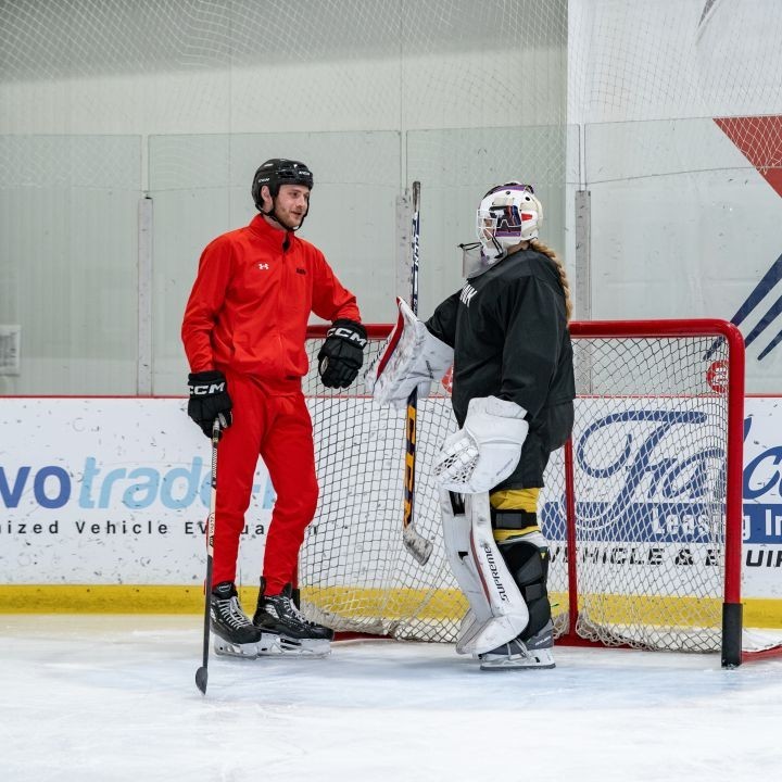 Shot of Nathan Cvar standing behind the goalie net