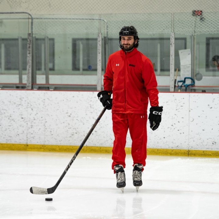 Image of smiling Gianluca "Gino" Esteves on the ice
