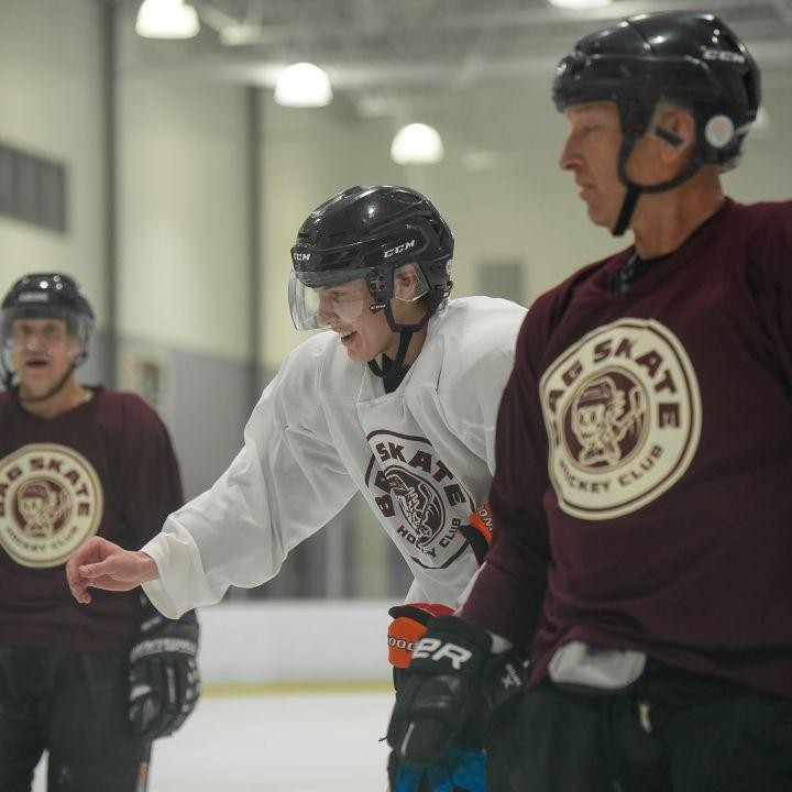 image of three bag skate hockey club players on the ice